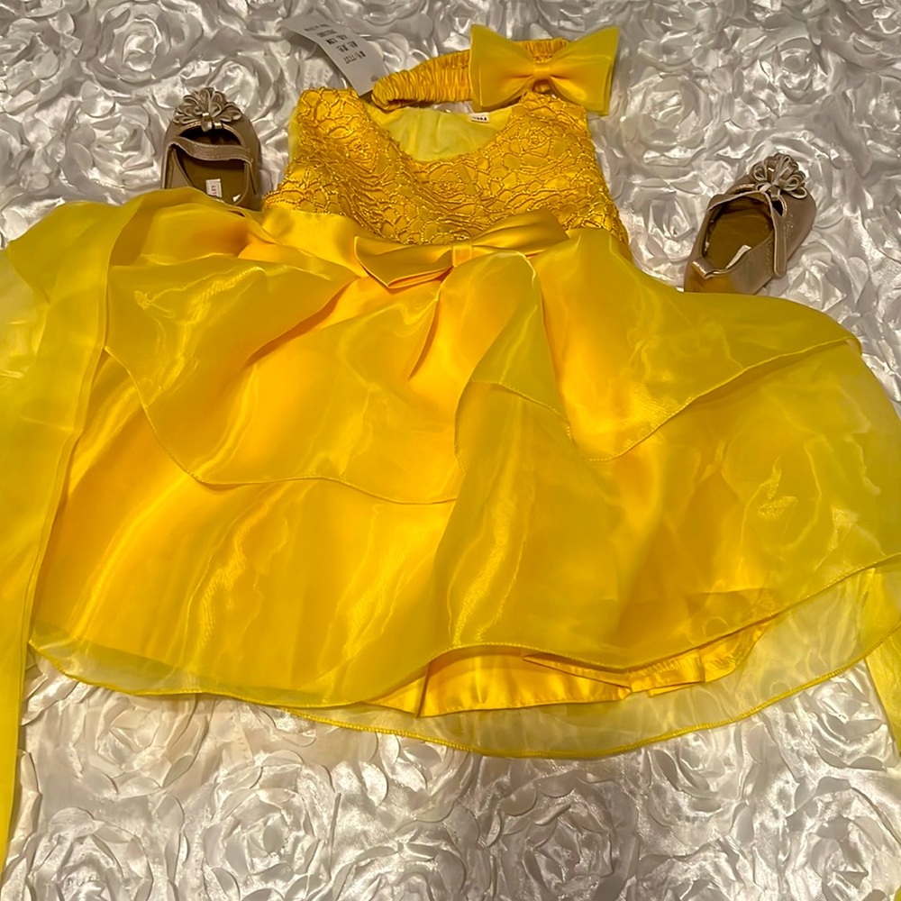 New Yellow princess dress with tag for a 12 month toddler. Made in China.